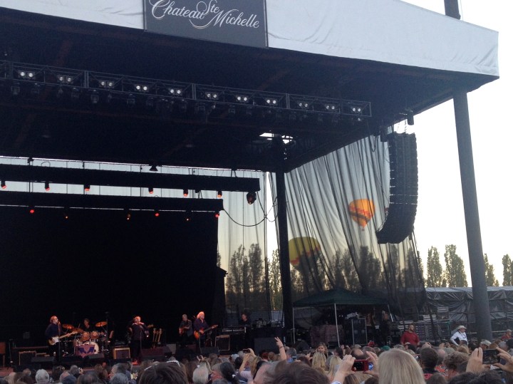 Stills, Nash, and Crosby start to play as hot-air balloons settle in behind them.