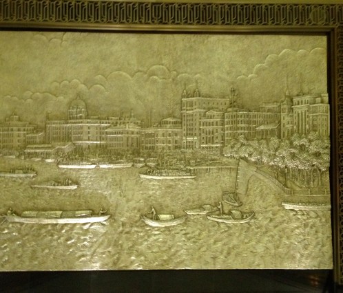 One of four reliefs on the hotel lobby walls