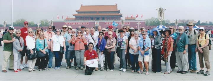 Our tour group in Tianenmen Square, with the iconic entrance to the Forbidden City, adorned with Mao's picture, in background.
