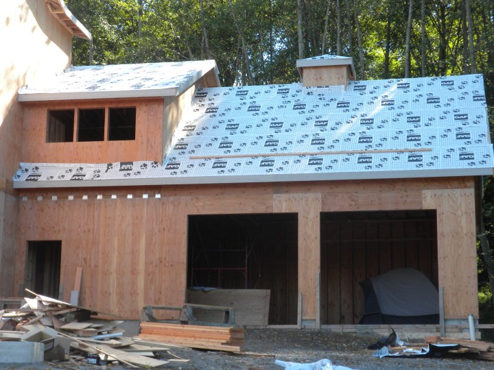 The garage with the first layer of roofing material and with the cupola added. The roof will be metal. 