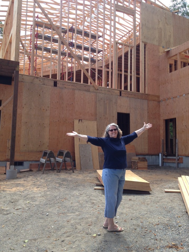 Robin celebrating, even before the last of the exterior plywood went on