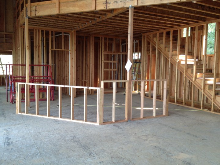 Framing for the kitchen counter and bar, where the sink and cooktop will go