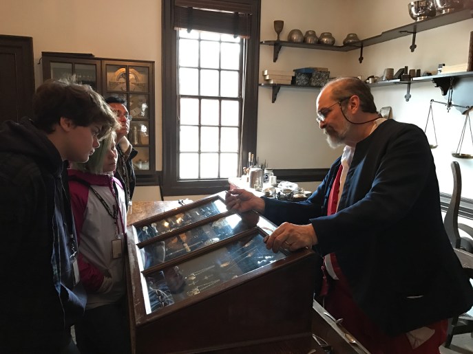 Sophia and Annika learn about silversmithing.