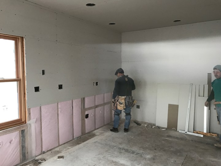 Drywall hanging has begun.