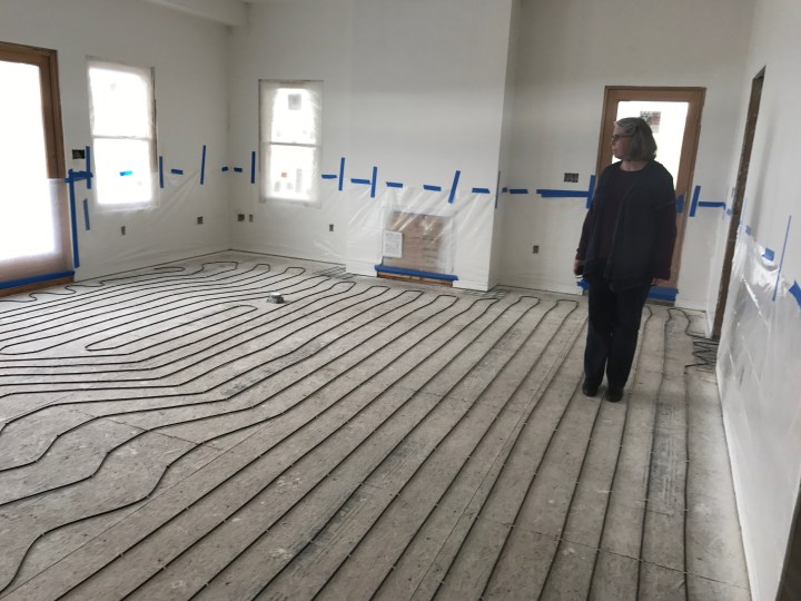Robin checking out the wires for electric heat in our bedroom