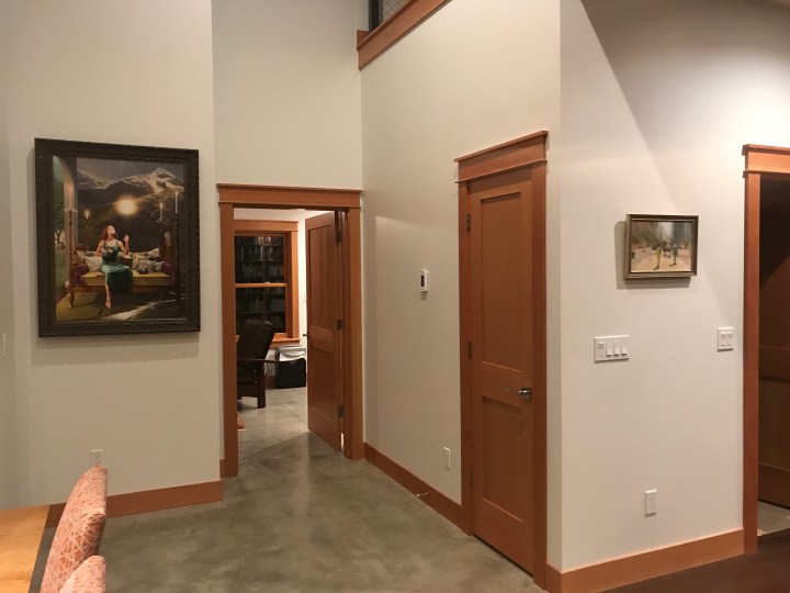 Two of the paintings that Rob Schouten helped us hang. The large one is by Rob; the small one, by my sister Nancy.