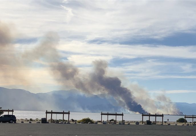 Smoke from a fire rising over the Salton Sea