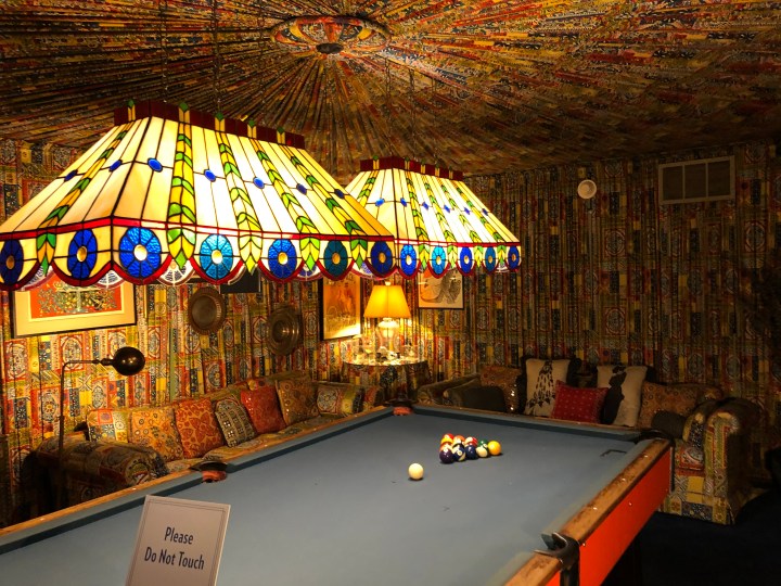 The billiard room, with fabric on the walls and ceiling